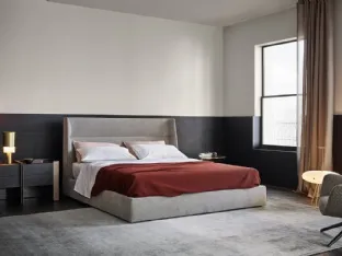 Fabric bed with Chloe headboard by Poliform