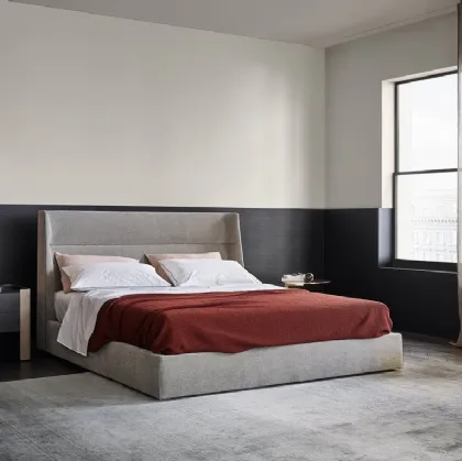 Fabric bed with Chloe headboard by Poliform