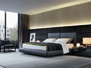 Leather upholstered bed with leather and velvet Dream headboard by Poliform.