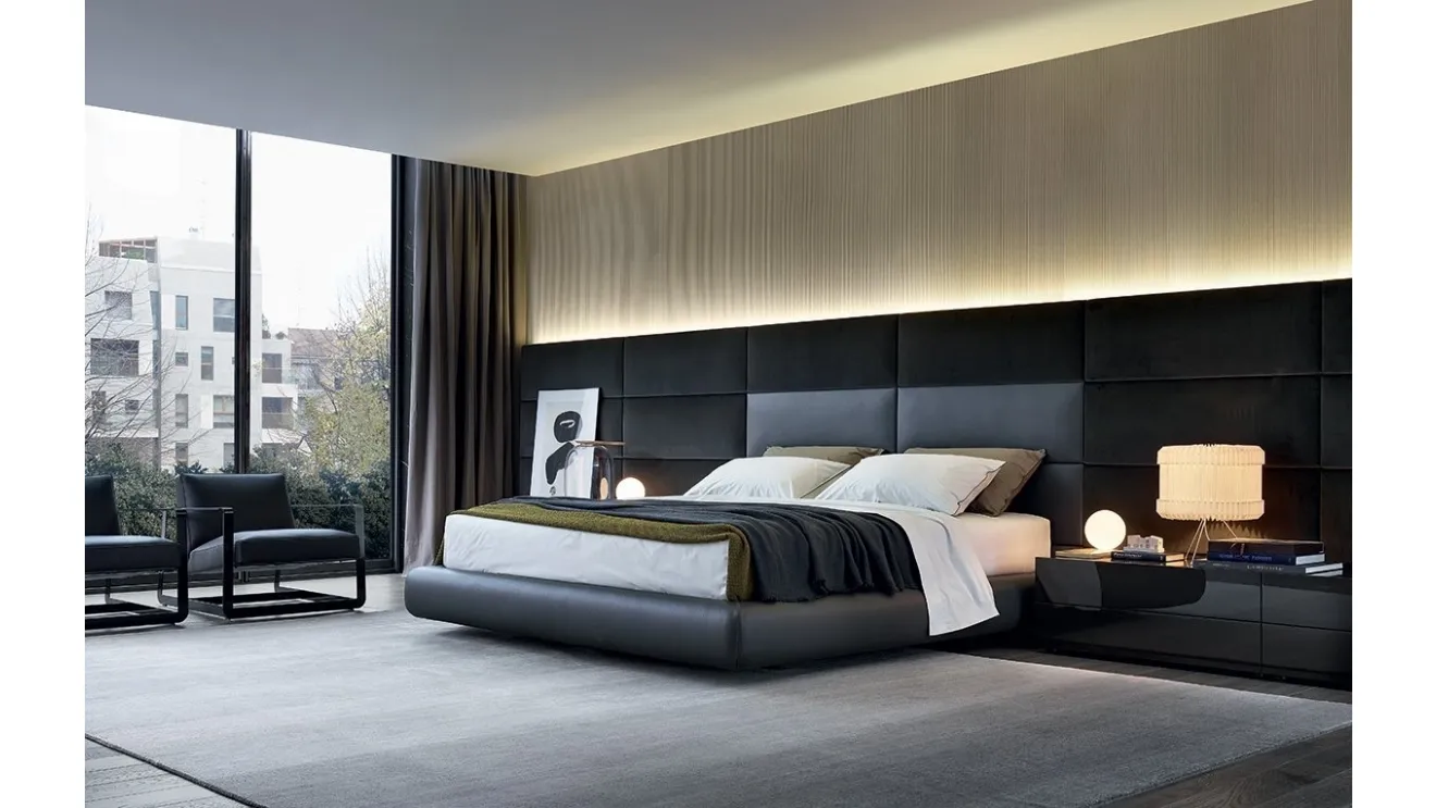 Leather upholstered bed with leather and velvet Dream headboard by Poliform.