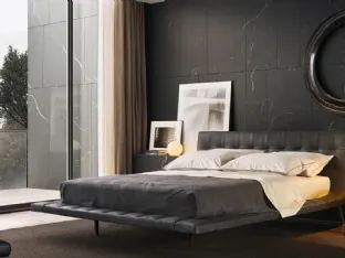 Aged leather bed with capitonné processing and brown nickel metal feet Wave by Poliform.