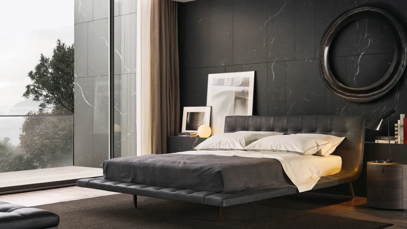 Aged leather bed with capitonné processing and brown nickel metal feet Wave by Poliform.