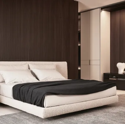 Fabric bed with Yume headboard by Poliform.