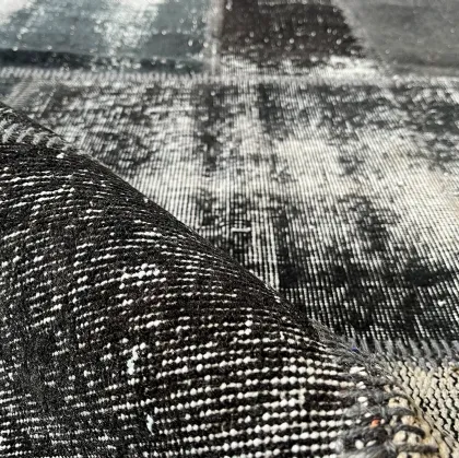 Patchwork Black Wool and Cotton Rug by Carpet Edition.