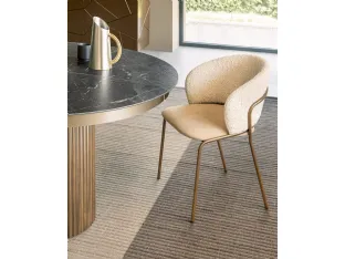 Vela chair in upholstered fabric by Riflessi.