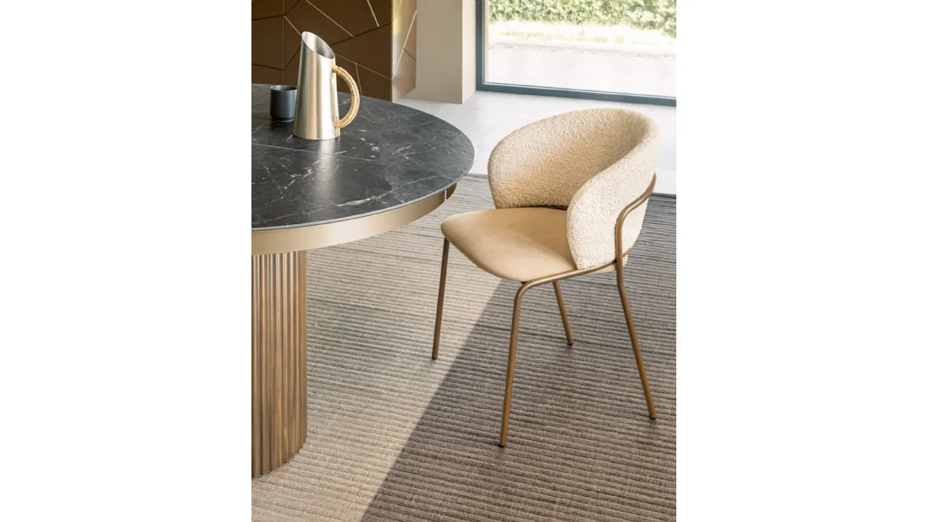 Vela chair in upholstered fabric by Riflessi.