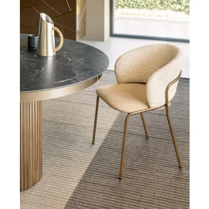 Vela chair in upholstered fabric by Riflessi.