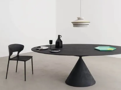 Clay sculpture table by Desalto with a geometric design with conical base